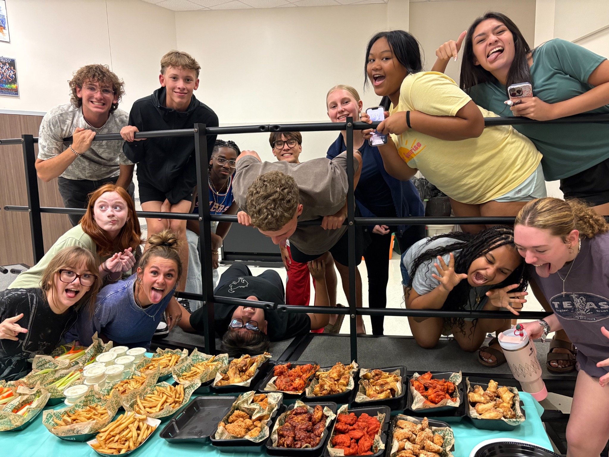 Sachse Choir students celebrating together at wing night