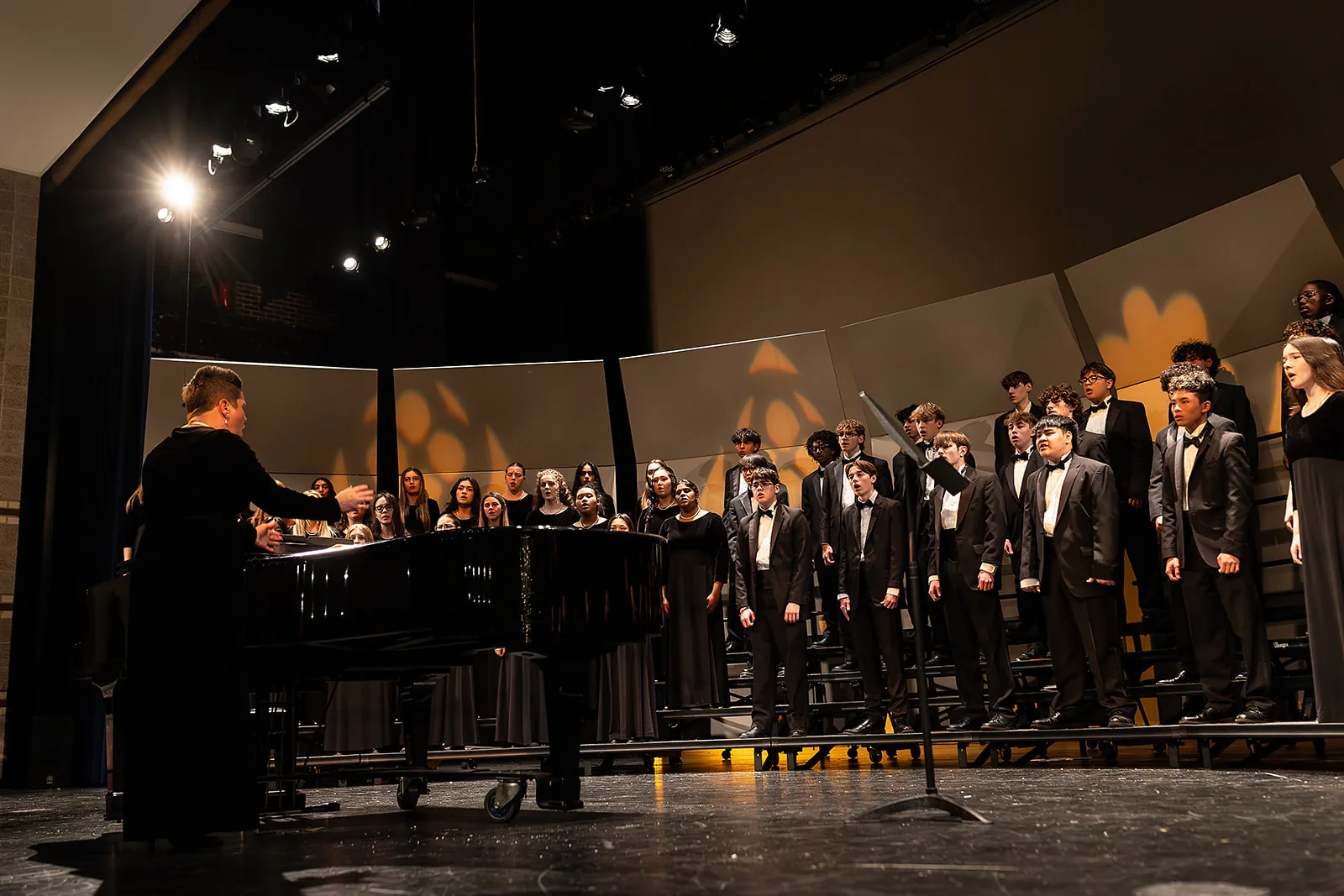 Tenor-bass singers performing in black tuxedos