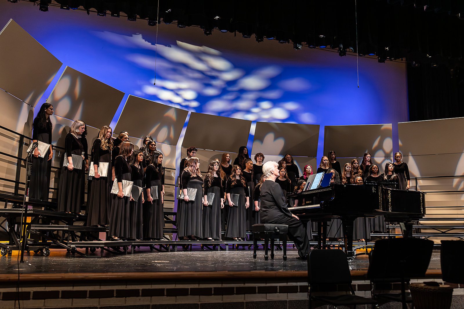 Bella Voce singers performing on stage