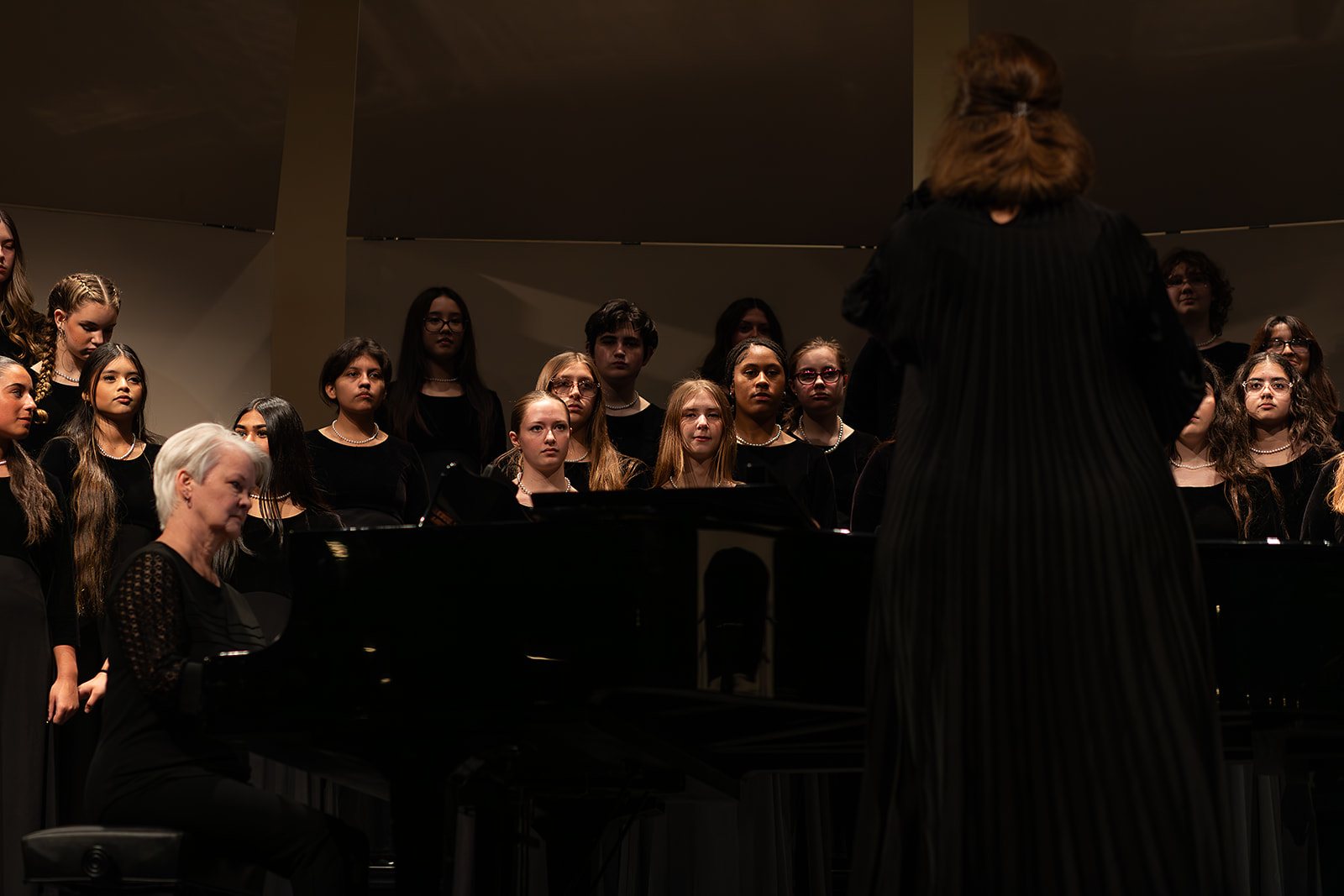 Bella Voce singers in rehearsal and performance