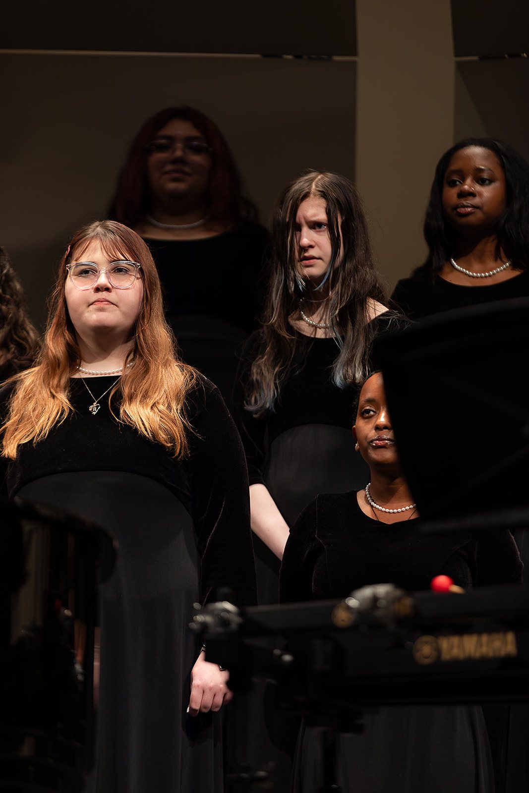 Bella Voce singer holding music folder